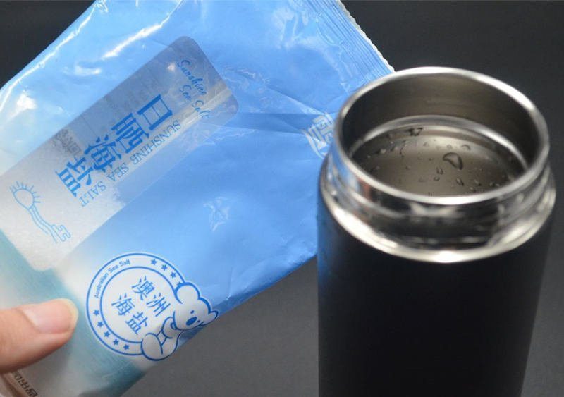 washing the stainless steel thermos bottle with salt