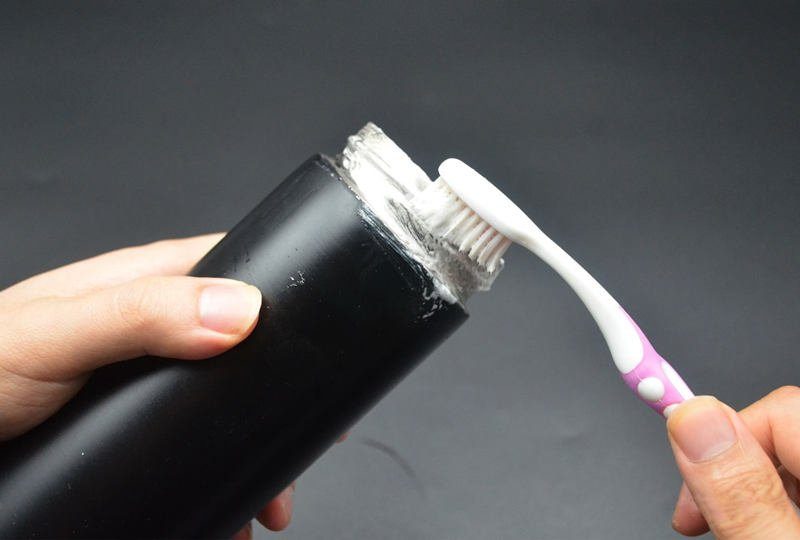 Washing stainless steel thermos bottle with toothpaste